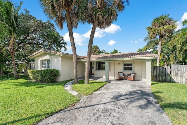 single story home featuring a front yard