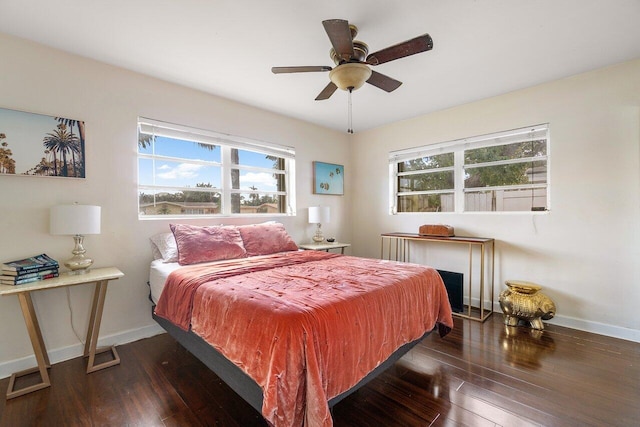 bedroom featuring ceiling fan and dark hardwood / wood-style flooring