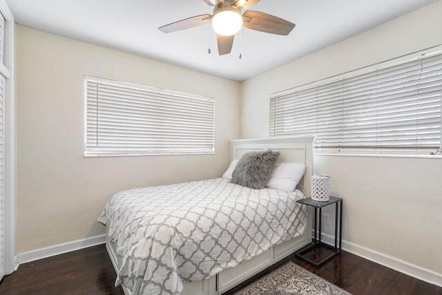 bedroom featuring ceiling fan and dark wood-type flooring