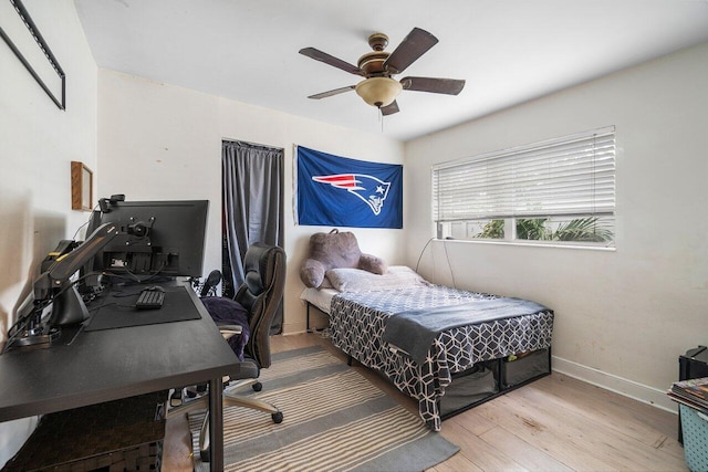 bedroom with hardwood / wood-style flooring and ceiling fan