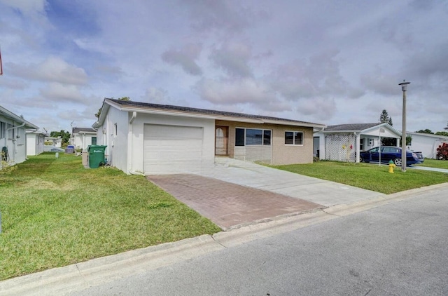 view of front of house featuring a front yard and a garage