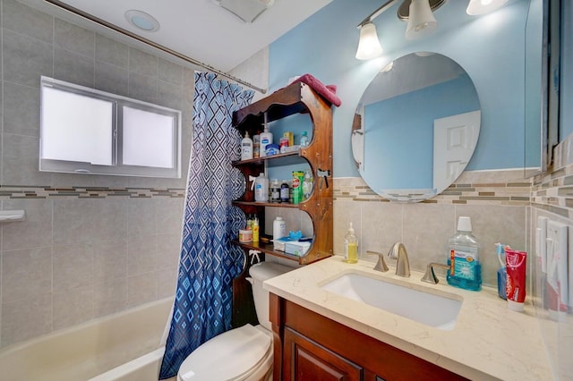 full bathroom with vanity, shower / bath combo, and toilet