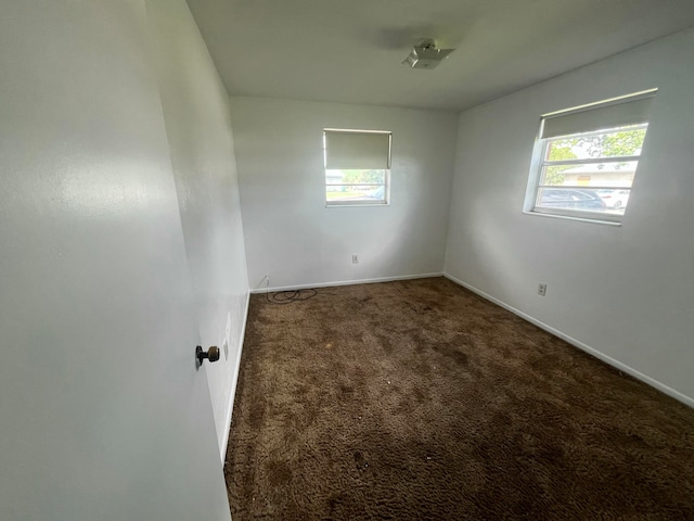 carpeted spare room with plenty of natural light