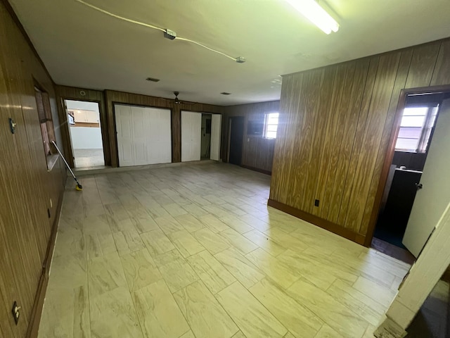 empty room with wood walls