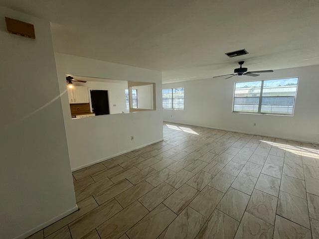 spare room with ceiling fan