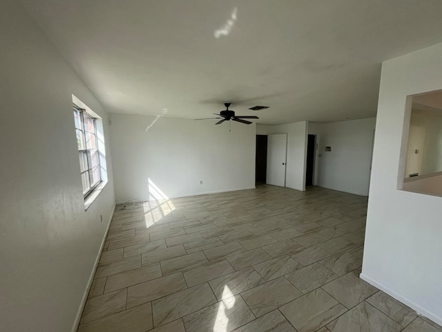 unfurnished room featuring ceiling fan