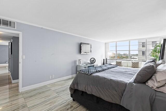 bedroom with ornamental molding