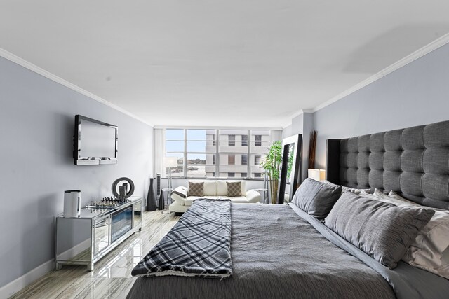 bedroom with light hardwood / wood-style flooring and ornamental molding