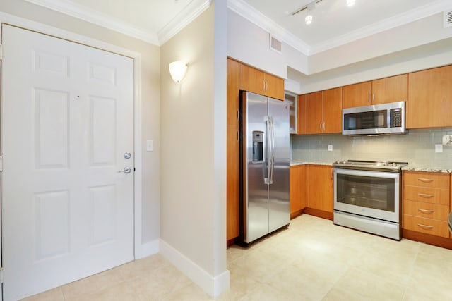 kitchen with ornamental molding, appliances with stainless steel finishes, backsplash, and light stone countertops