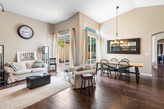 living room featuring a chandelier, vaulted ceiling, and dark hardwood / wood-style floors