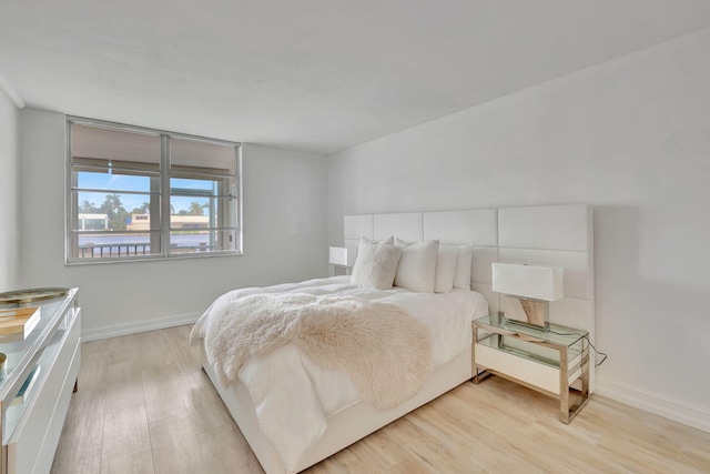 bedroom with light hardwood / wood-style flooring