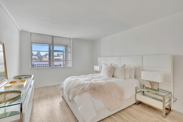 bedroom with light wood-type flooring