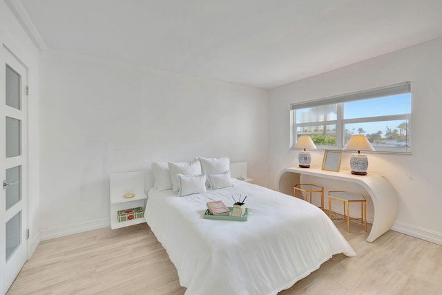 bedroom with light wood-type flooring