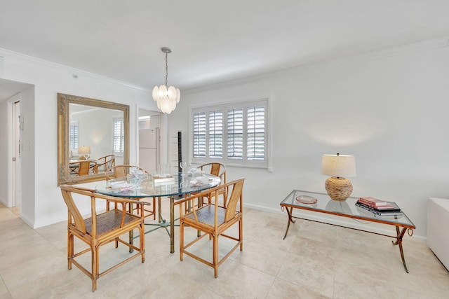 tiled dining space with ornamental molding and an inviting chandelier