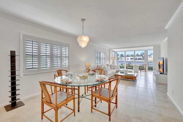 dining room featuring light tile patterned floors, an inviting chandelier, and crown molding