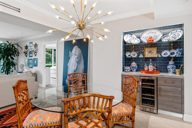 dining space featuring indoor bar, crown molding, and wine cooler