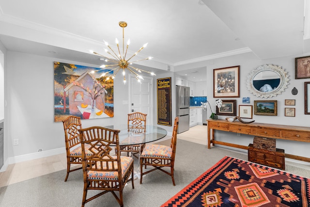 dining area with light carpet, a notable chandelier, and crown molding