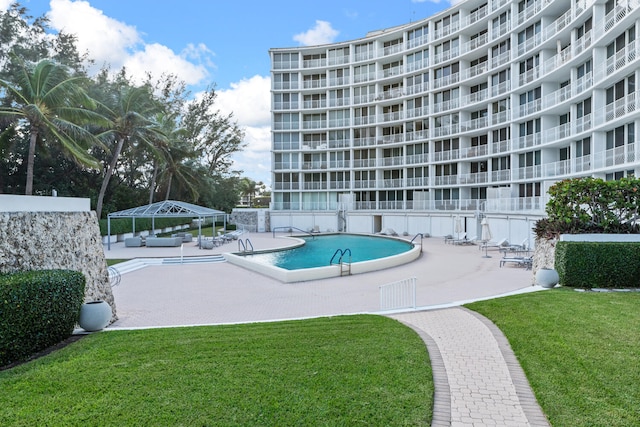 view of pool featuring a gazebo, a lawn, and a patio area