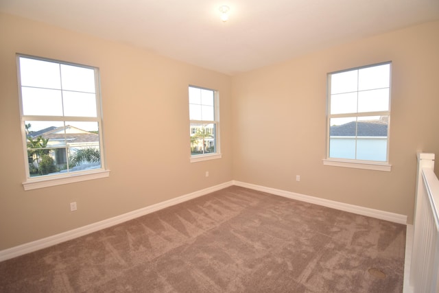 empty room featuring carpet flooring