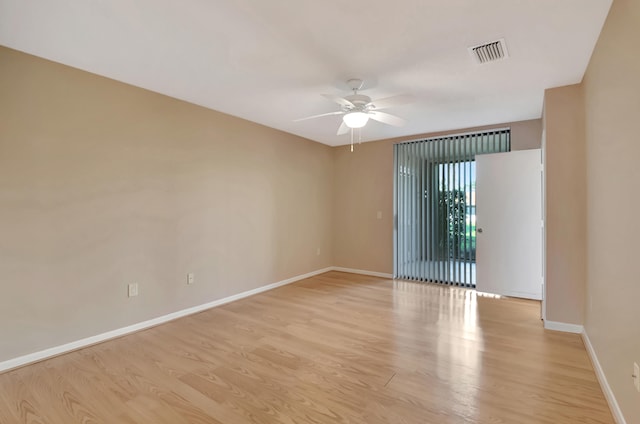 unfurnished room with light wood-type flooring and ceiling fan