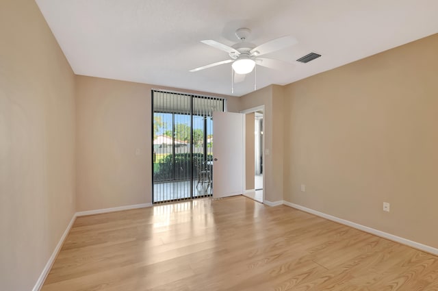 unfurnished room featuring ceiling fan and light wood-type flooring