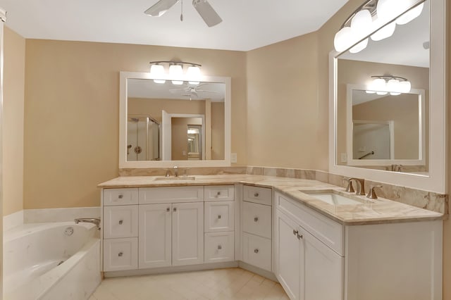 bathroom featuring vanity, ceiling fan, and independent shower and bath