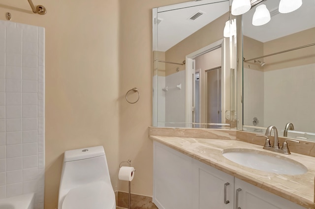 bathroom featuring vanity and toilet