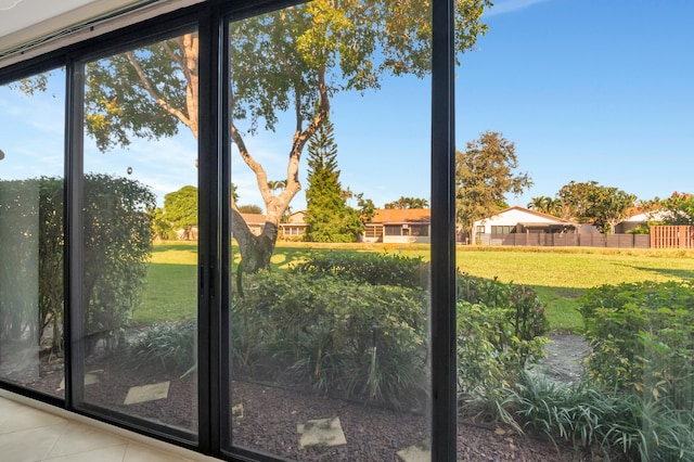 doorway to outside with tile patterned floors