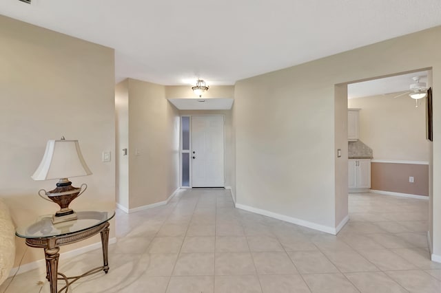 hallway featuring light tile patterned floors