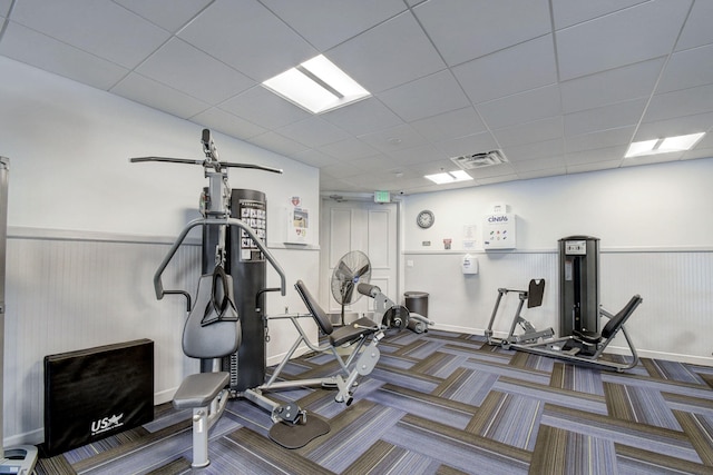 gym featuring a drop ceiling