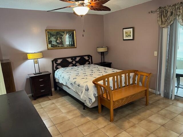 bedroom featuring light tile patterned flooring and ceiling fan