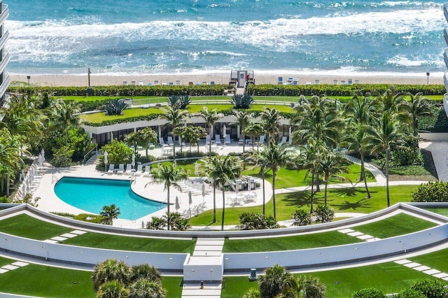 bird's eye view featuring a water view and a beach view