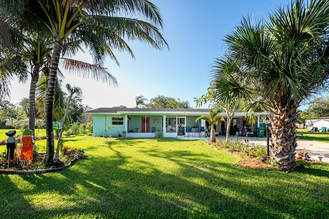 ranch-style house with a front lawn