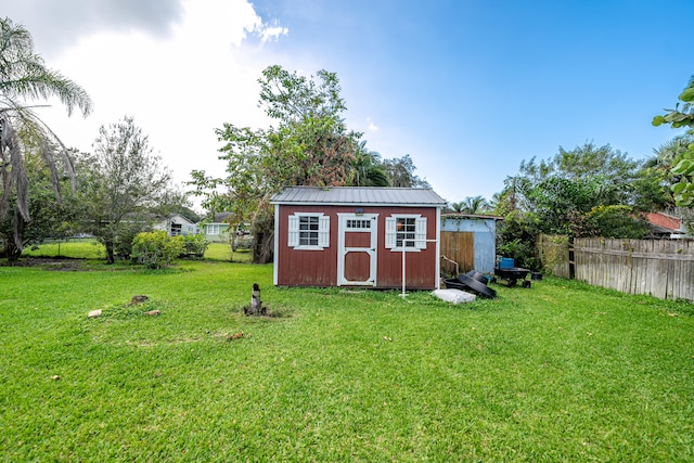 view of outdoor structure featuring a lawn