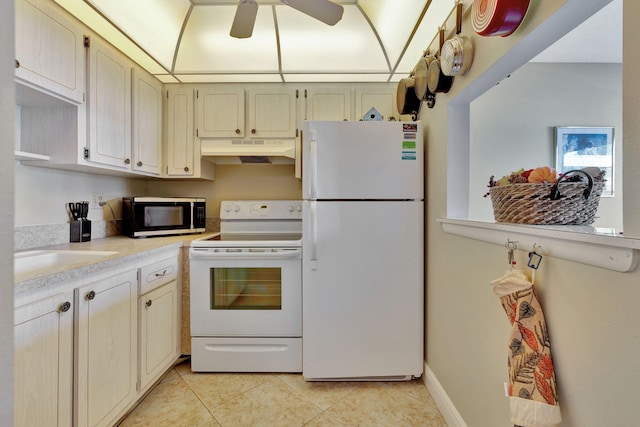 kitchen with sink, light tile patterned flooring, white appliances, and ceiling fan