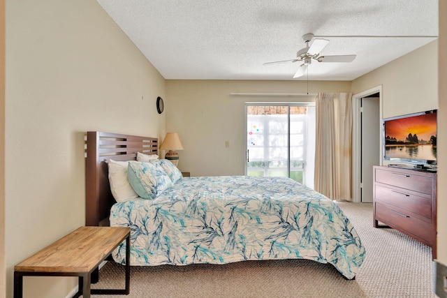 carpeted bedroom featuring ceiling fan, access to outside, and a textured ceiling