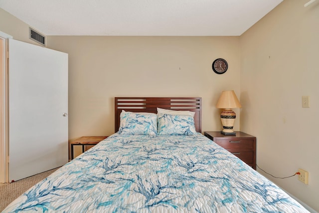 bedroom featuring light carpet