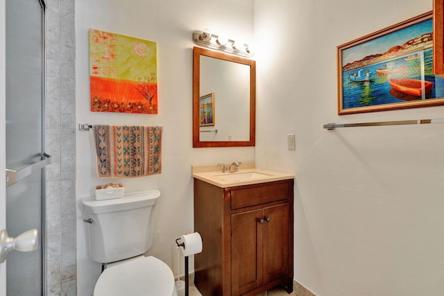 bathroom featuring toilet and vanity