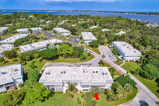 birds eye view of property with a water view