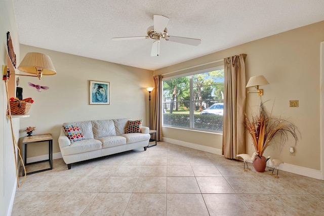 living room with light tile patterned flooring and a textured ceiling