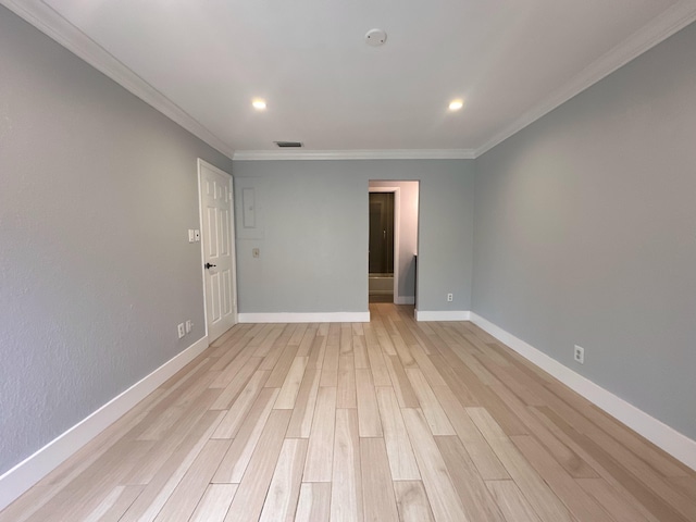 unfurnished room with light hardwood / wood-style floors and ornamental molding