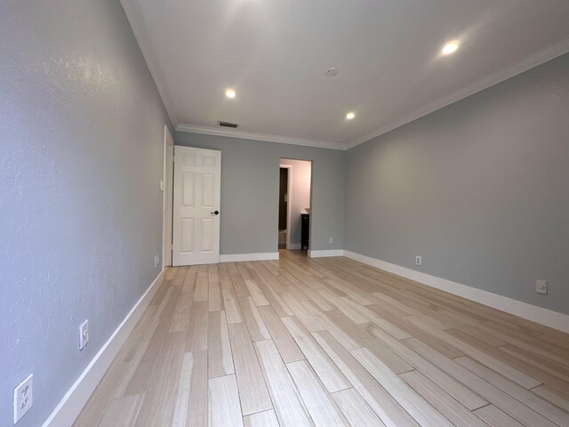 9638 NW 65th St Unit C10, Tamarac, FL 33321 - spare room with ornamental molding, light wood-style floors, recessed lighting, and baseboards