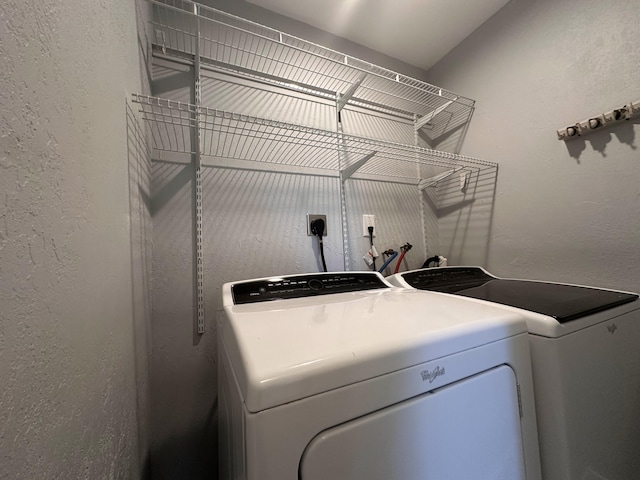 clothes washing area with independent washer and dryer