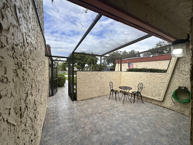 view of patio with a lanai