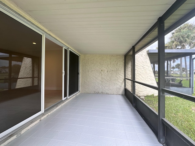 unfurnished sunroom featuring a healthy amount of sunlight