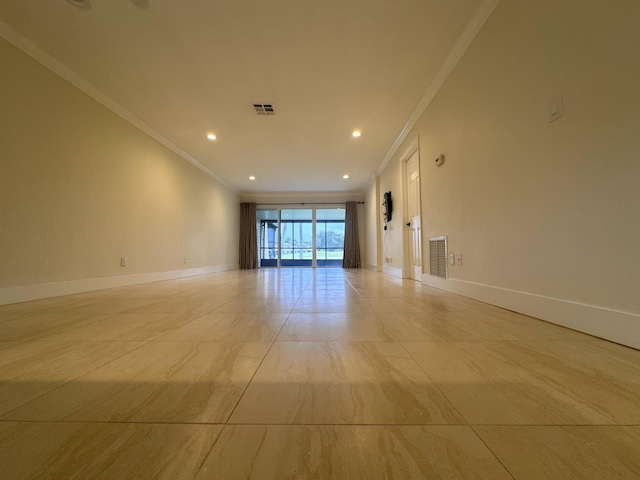 unfurnished room featuring crown molding