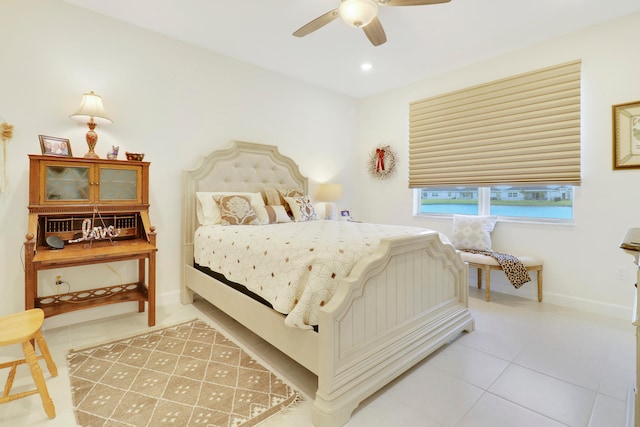 tiled bedroom with ceiling fan