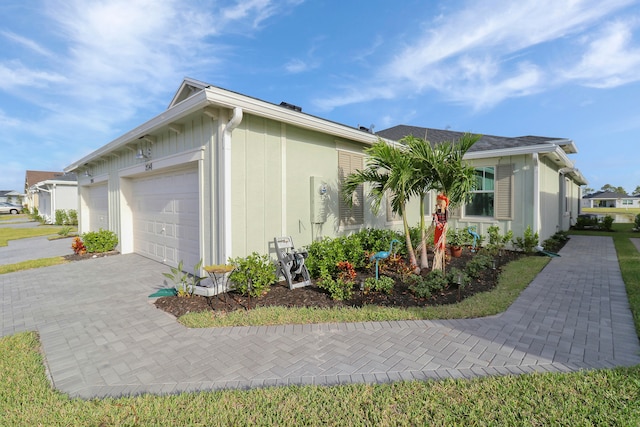 view of side of property featuring a garage