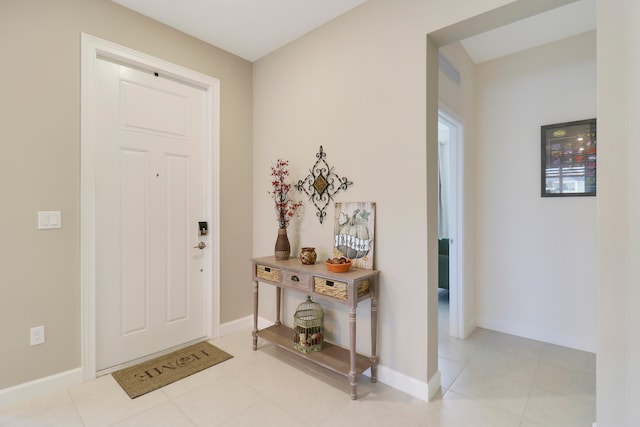 foyer entrance featuring light tile patterned flooring