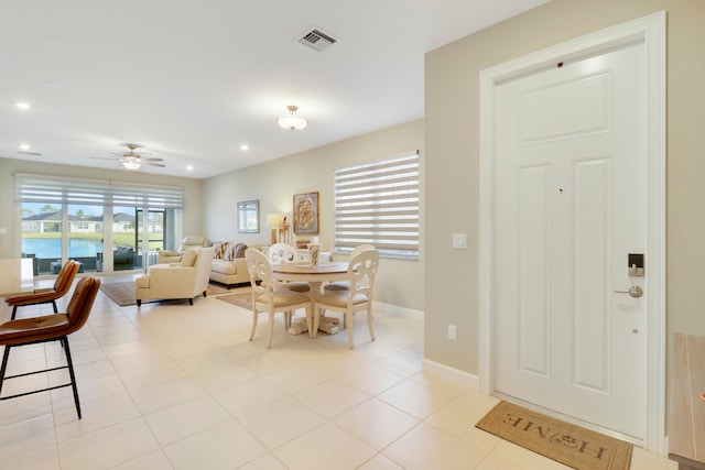 dining area featuring light tile patterned floors and ceiling fan